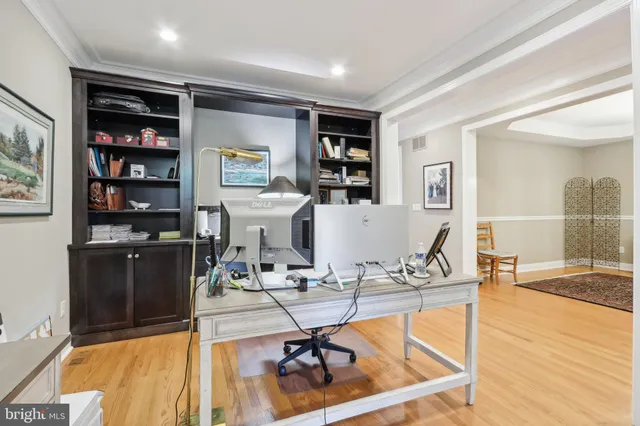 a view of a workspace with furniture