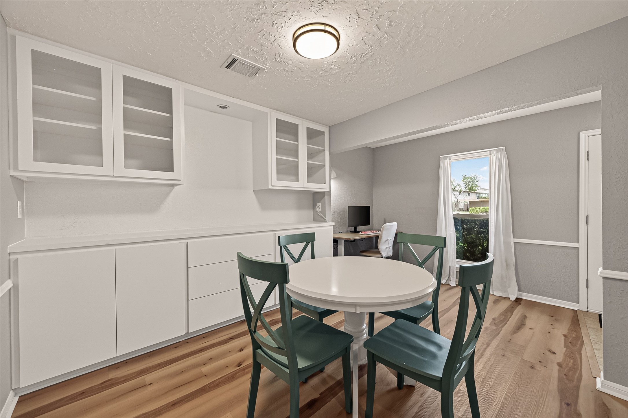 Elegant formal area featuring custom built-ins for stylish storage and display.