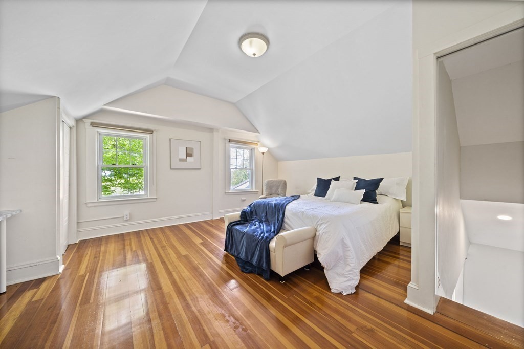 95 Monroe Road, Unit 2R Quincy, MA 02169 - Photo 13 of 19 a bedroom with a bed and wooden floor
