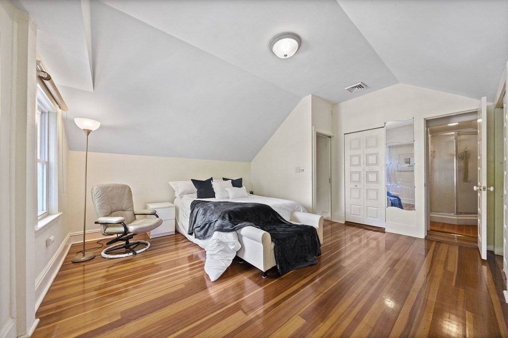 95 Monroe Road, Unit 2R Quincy, MA 02169 - Photo 14 of 19 a bedroom with furniture and a wooden floor
