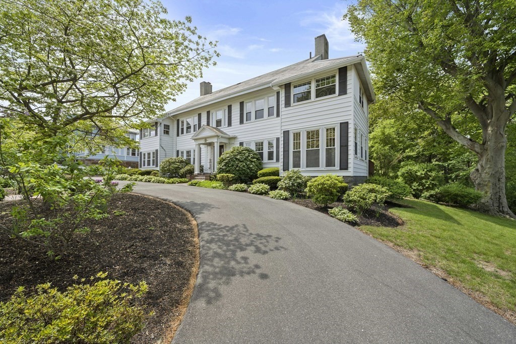 95 Monroe Road, Unit 2R Quincy, MA 02169 - Photo 2 of 19 a front view of a house with a yard