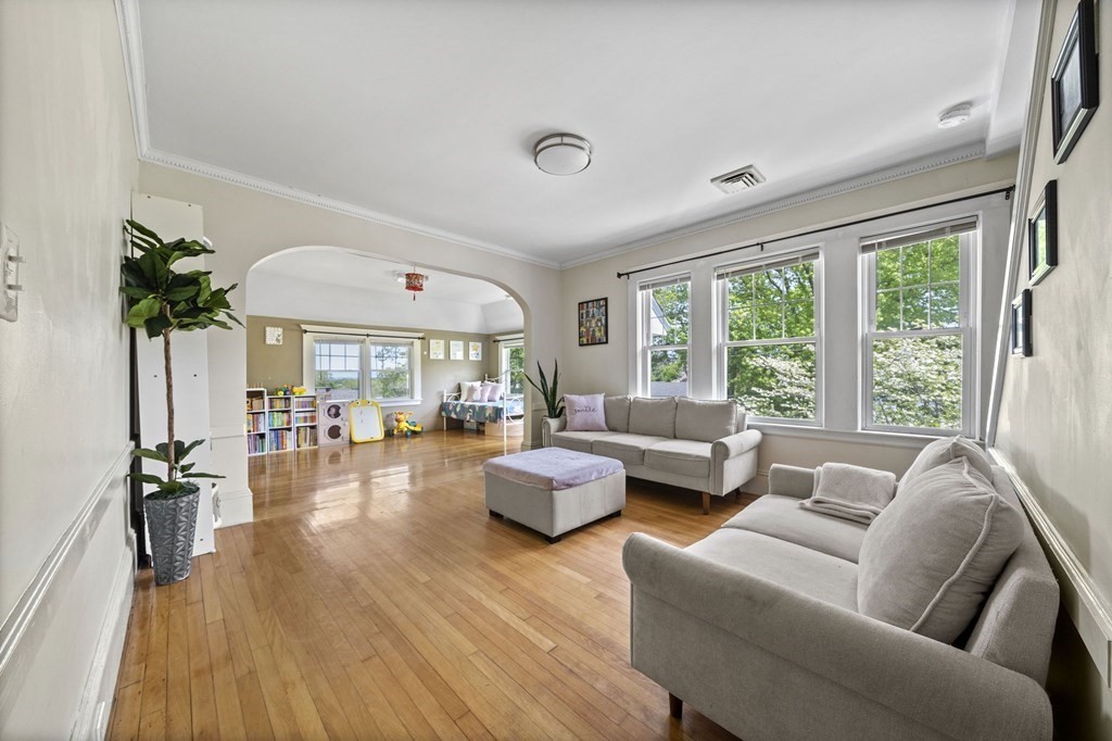95 Monroe Road, Unit 2R Quincy, MA 02169 - Photo 3 of 19 a living room with furniture and a large window