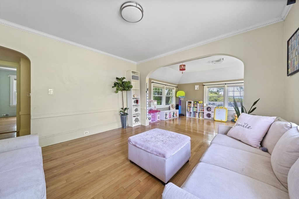 95 Monroe Road, Unit 2R Quincy, MA 02169 - Photo 5 of 19 a living room with furniture and wooden floor
