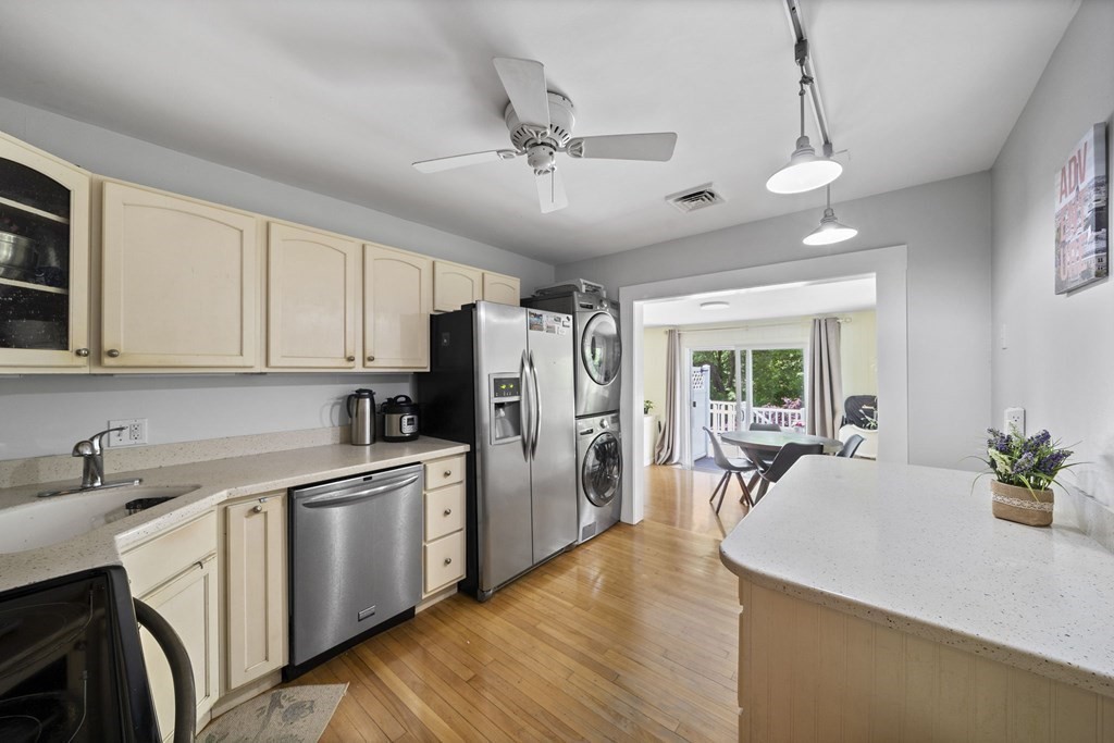 95 Monroe Road, Unit 2R Quincy, MA 02169 - Photo 7 of 19 a kitchen that has a lot of cabinets in it and stainless steel appliances