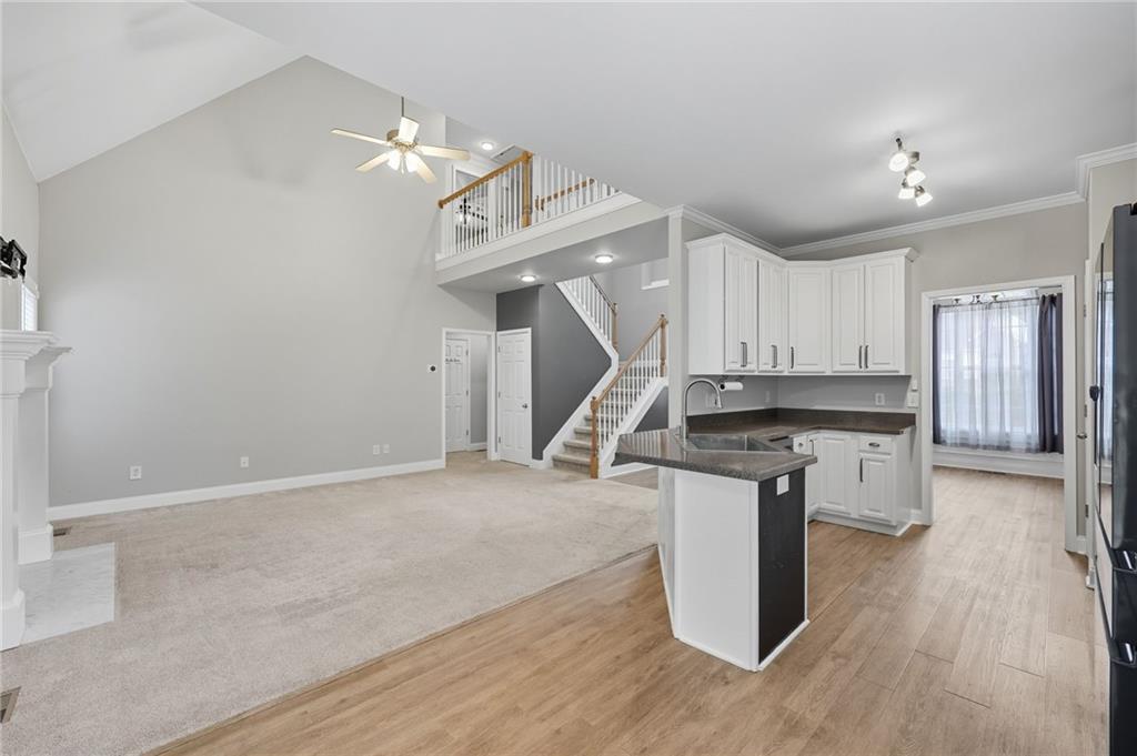 4260 Mountain Ridge Road Gainesville, GA 30506 - Photo 11 of 39 a kitchen with a stove a sink and a refrigerator