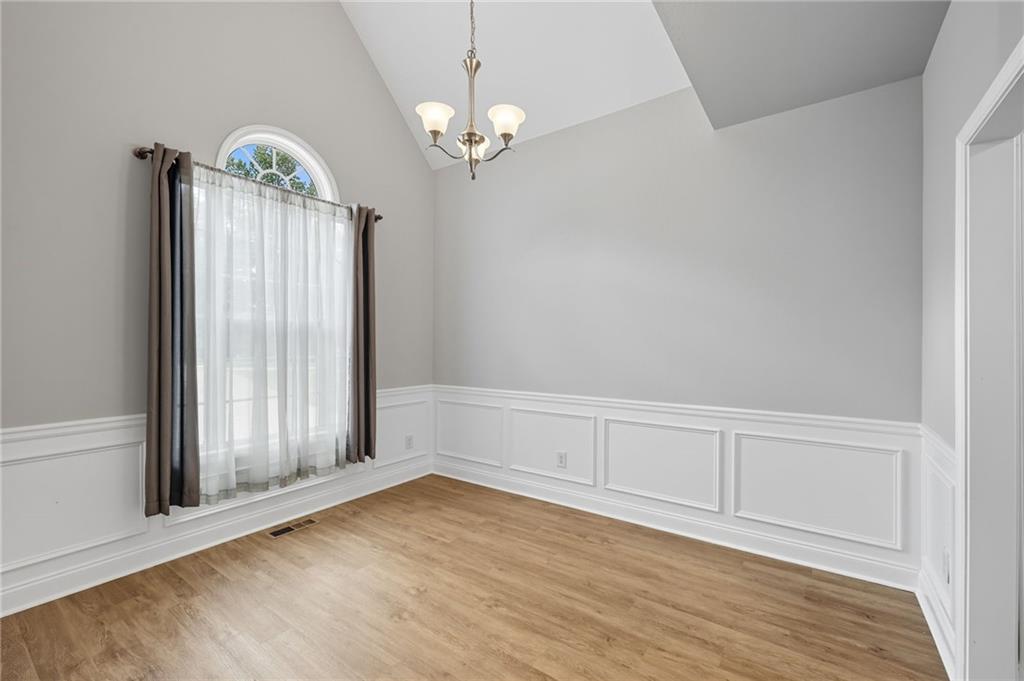 4260 Mountain Ridge Road Gainesville, GA 30506 - Photo 15 of 39 wooden floor in an empty room with a window