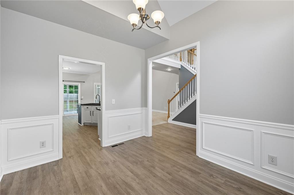 4260 Mountain Ridge Road Gainesville, GA 30506 - Photo 16 of 39 wooden floor in an empty room with a window