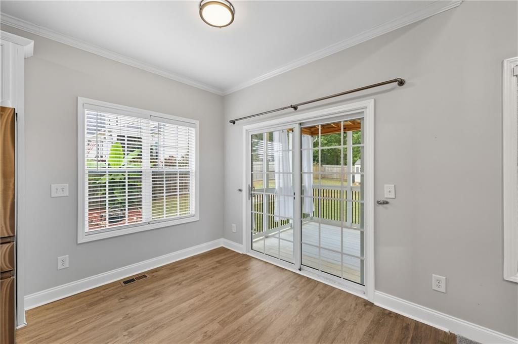 4260 Mountain Ridge Road Gainesville, GA 30506 - Photo 17 of 39 a view of an empty room with wooden floor and a window