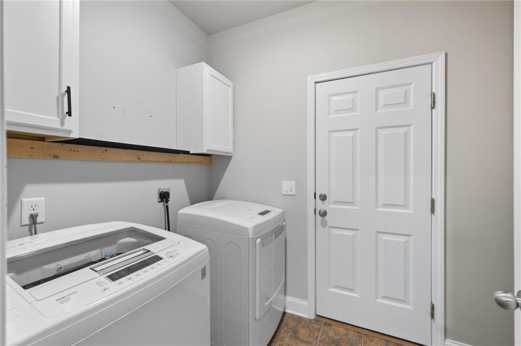 4260 Mountain Ridge Road Gainesville, GA 30506 - Photo 26 of 39 a view of storage and utility room with washer and dryer
