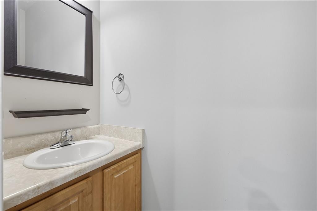 4260 Mountain Ridge Road Gainesville, GA 30506 - Photo 27 of 39 a bathroom with a sink and a mirror