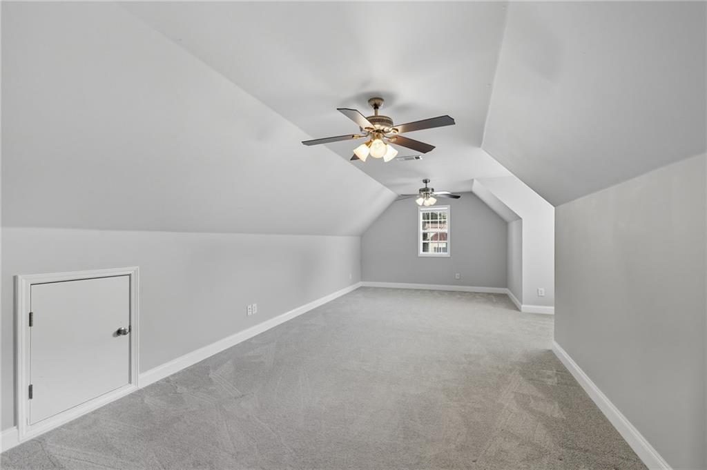 4260 Mountain Ridge Road Gainesville, GA 30506 - Photo 31 of 39 a view of a hallway with a ceiling fan