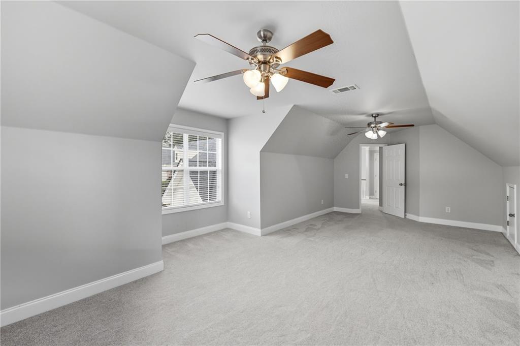 4260 Mountain Ridge Road Gainesville, GA 30506 - Photo 32 of 39 en view interior of a house with a chandelier fan and windows