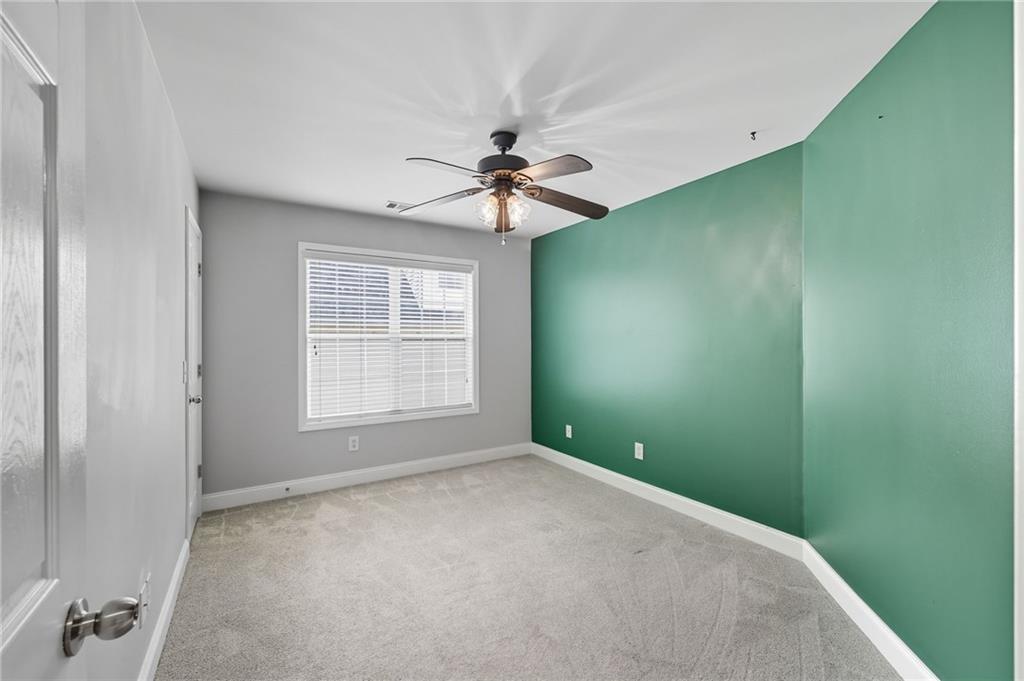 4260 Mountain Ridge Road Gainesville, GA 30506 - Photo 33 of 39 a view of a room with a ceiling fan and a window