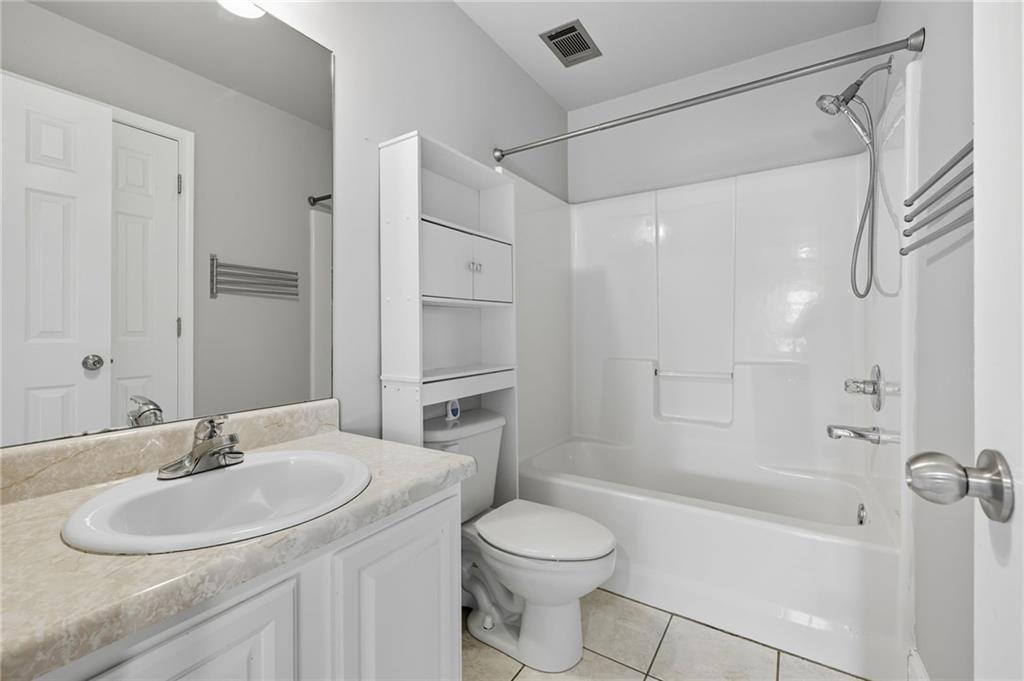 4260 Mountain Ridge Road Gainesville, GA 30506 - Photo 35 of 39 a bathroom with a sink toilet and shower