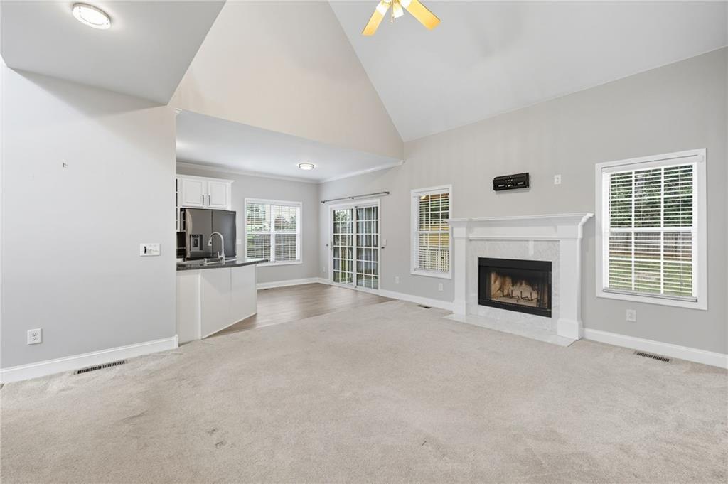 4260 Mountain Ridge Road Gainesville, GA 30506 - Photo 8 of 39 a view of a livingroom with an empty space and a fireplace