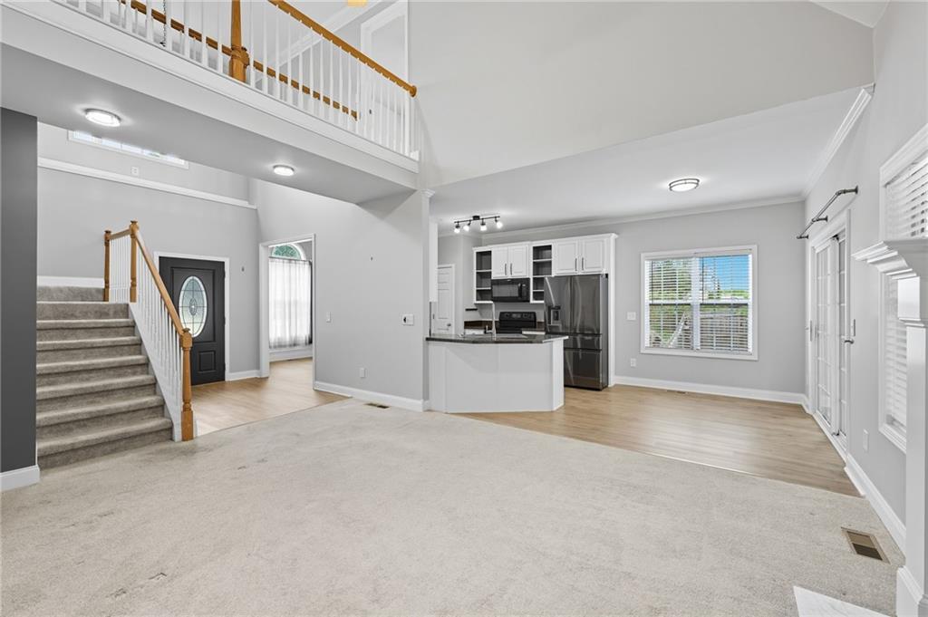 4260 Mountain Ridge Road Gainesville, GA 30506 - Photo 9 of 39 a view of a kitchen with refrigerator and a kitchen