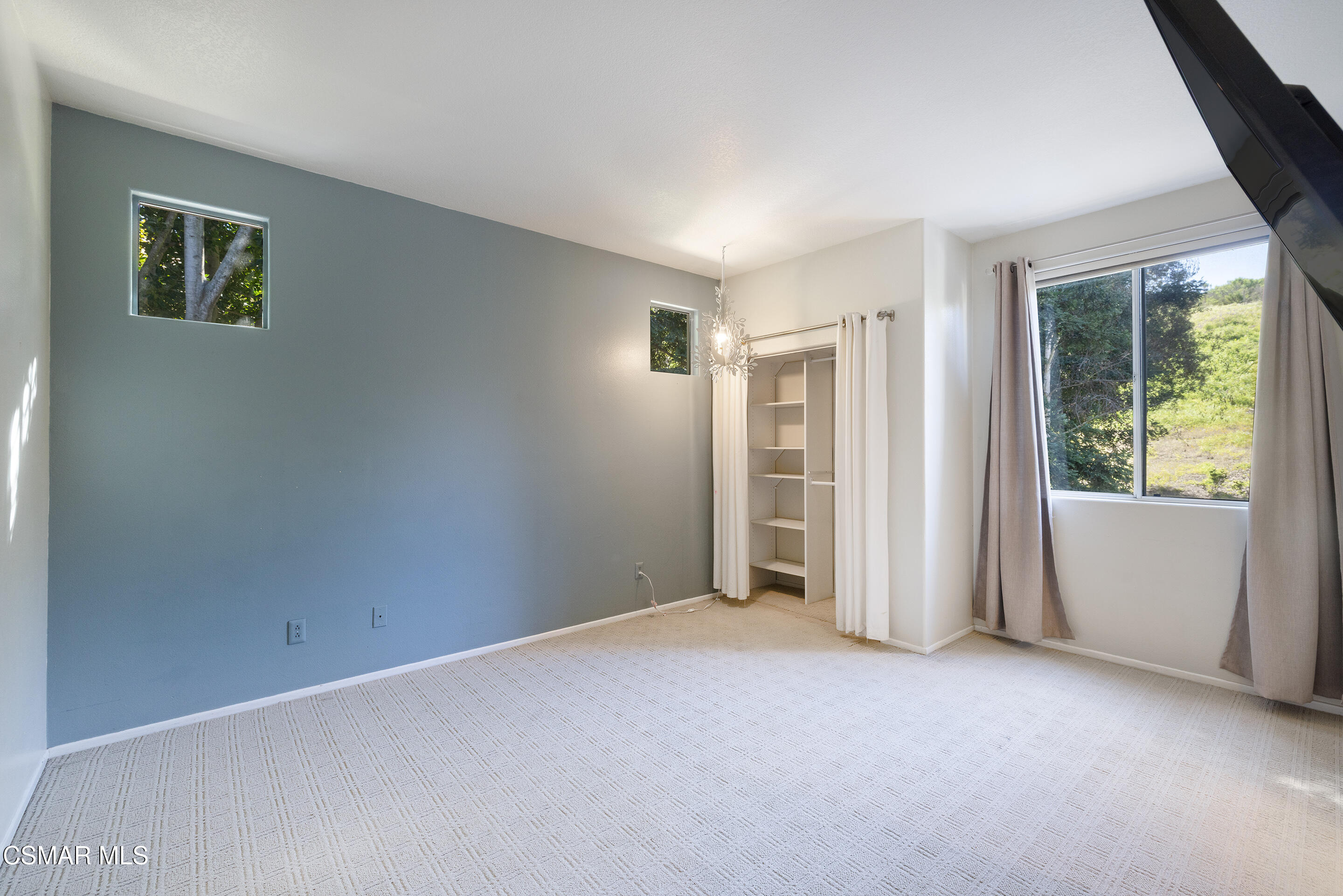3881 Timberridge Road Moorpark, CA 93021 - Photo 23 of 28 an empty room with windows and closet