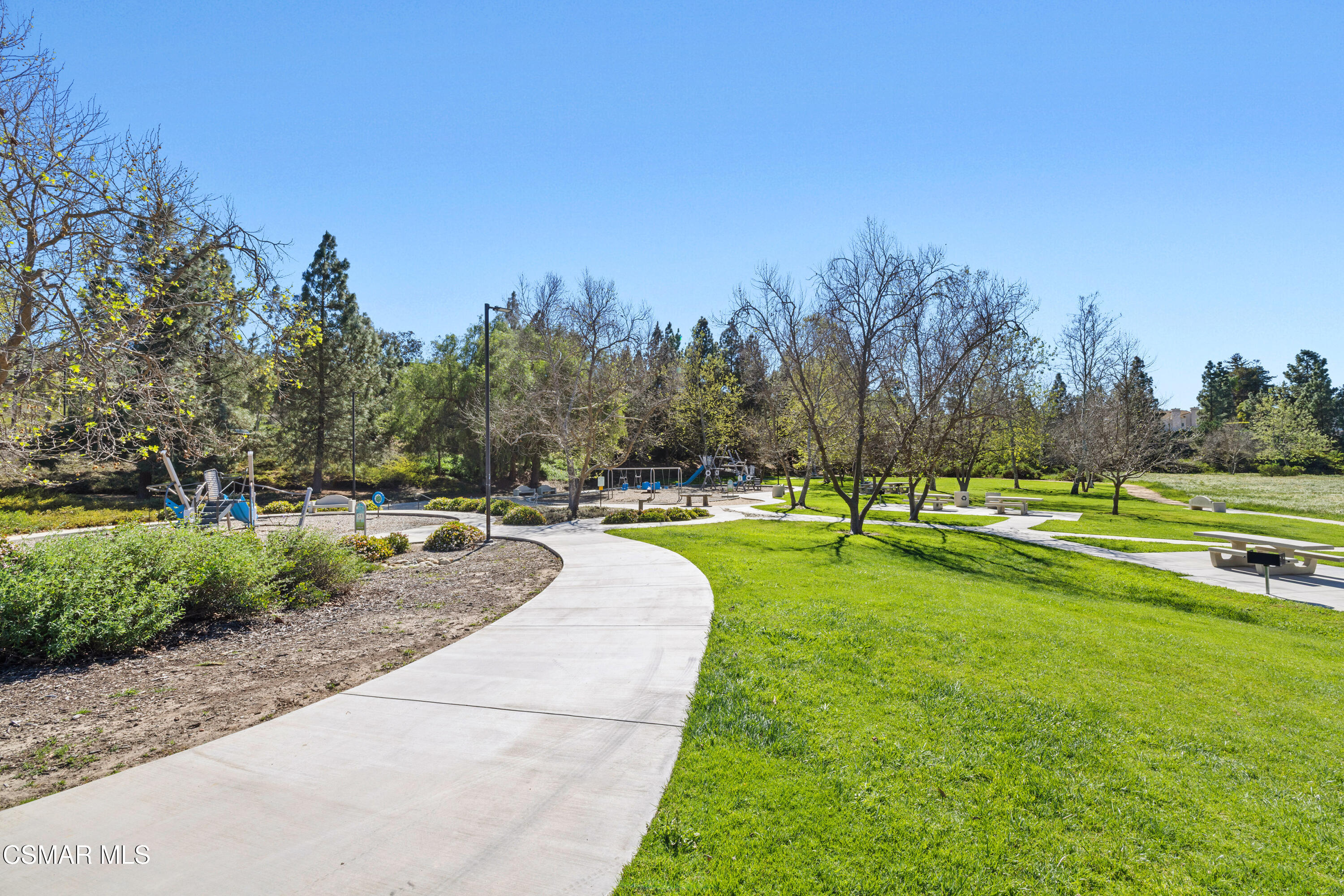 3881 Timberridge Road Moorpark, CA 93021 - Photo 28 of 28 a swimming pool with lots of tress in the background