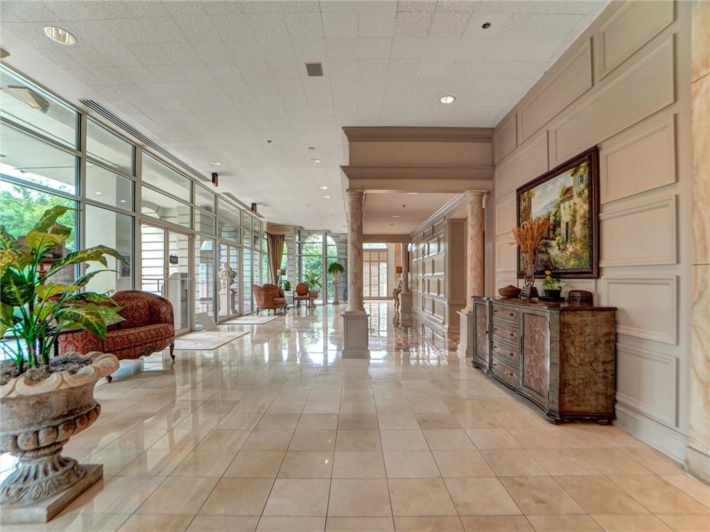 3435 Kingsboro Road Northeast, Unit 1601 Atlanta, GA 30326 - Photo 50 of 54 a lobby with furniture and floor to ceiling window
