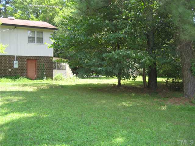 8341 Ebenezer Church Road Raleigh, NC 27617 - Photo 2 of 3 a view of a house with a yard