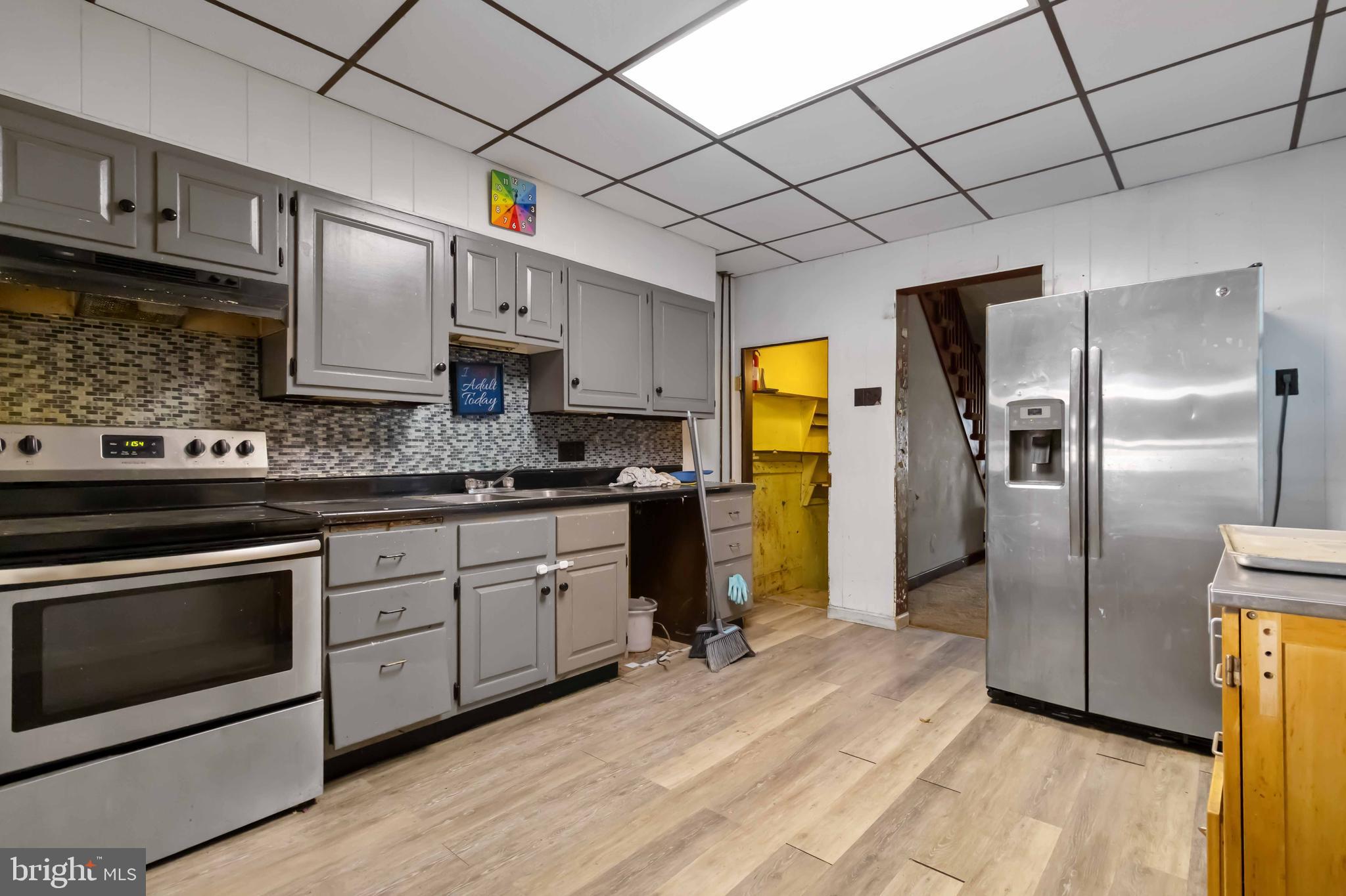 11 West Commerce Street Shamokin, PA 17872 - Photo 12 of 24 a kitchen with stainless steel appliances granite countertop a refrigerator a stove top oven a sink and dishwasher