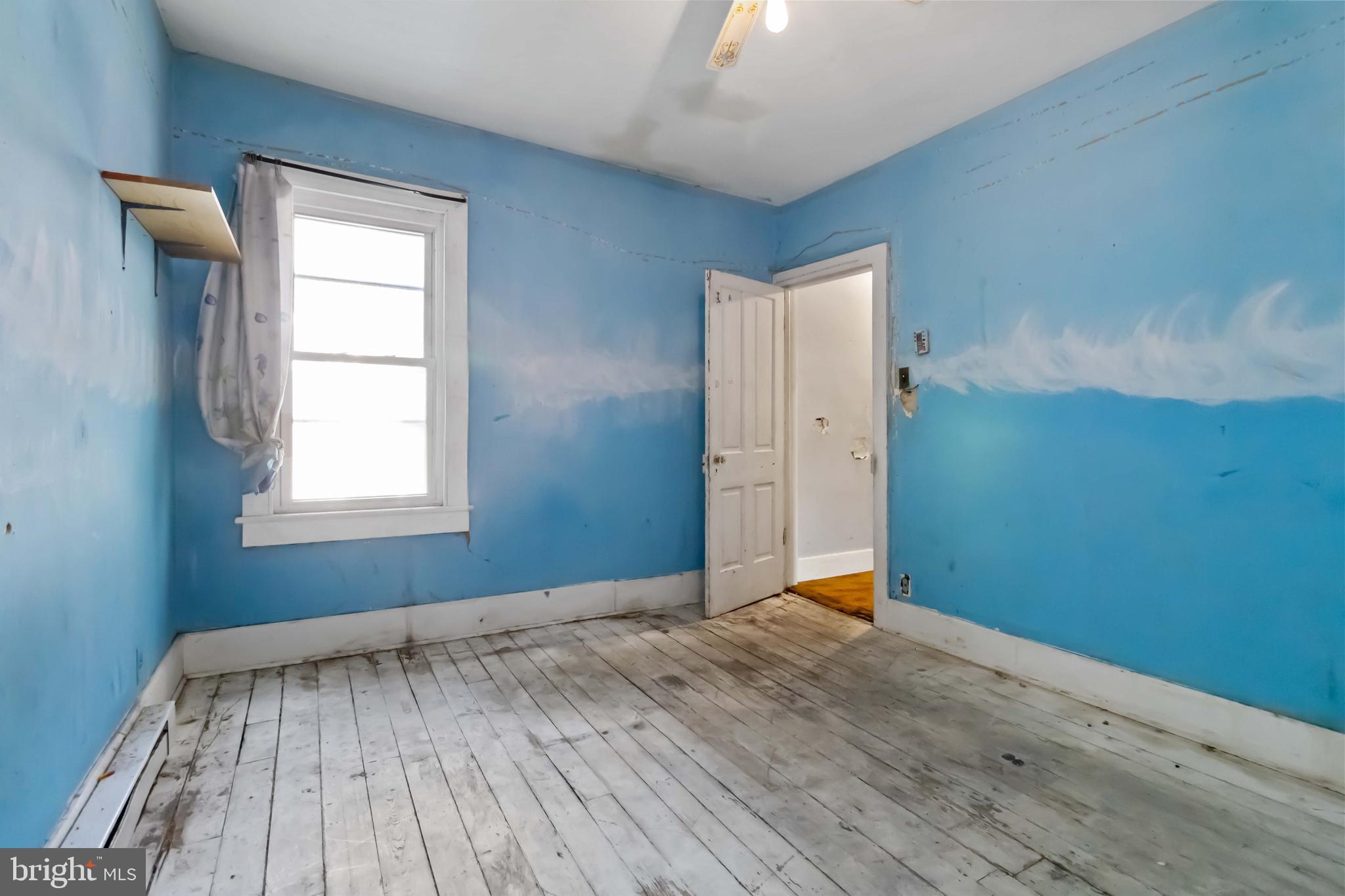 11 West Commerce Street Shamokin, PA 17872 - Photo 17 of 24 a view of room with window and hardwood floor