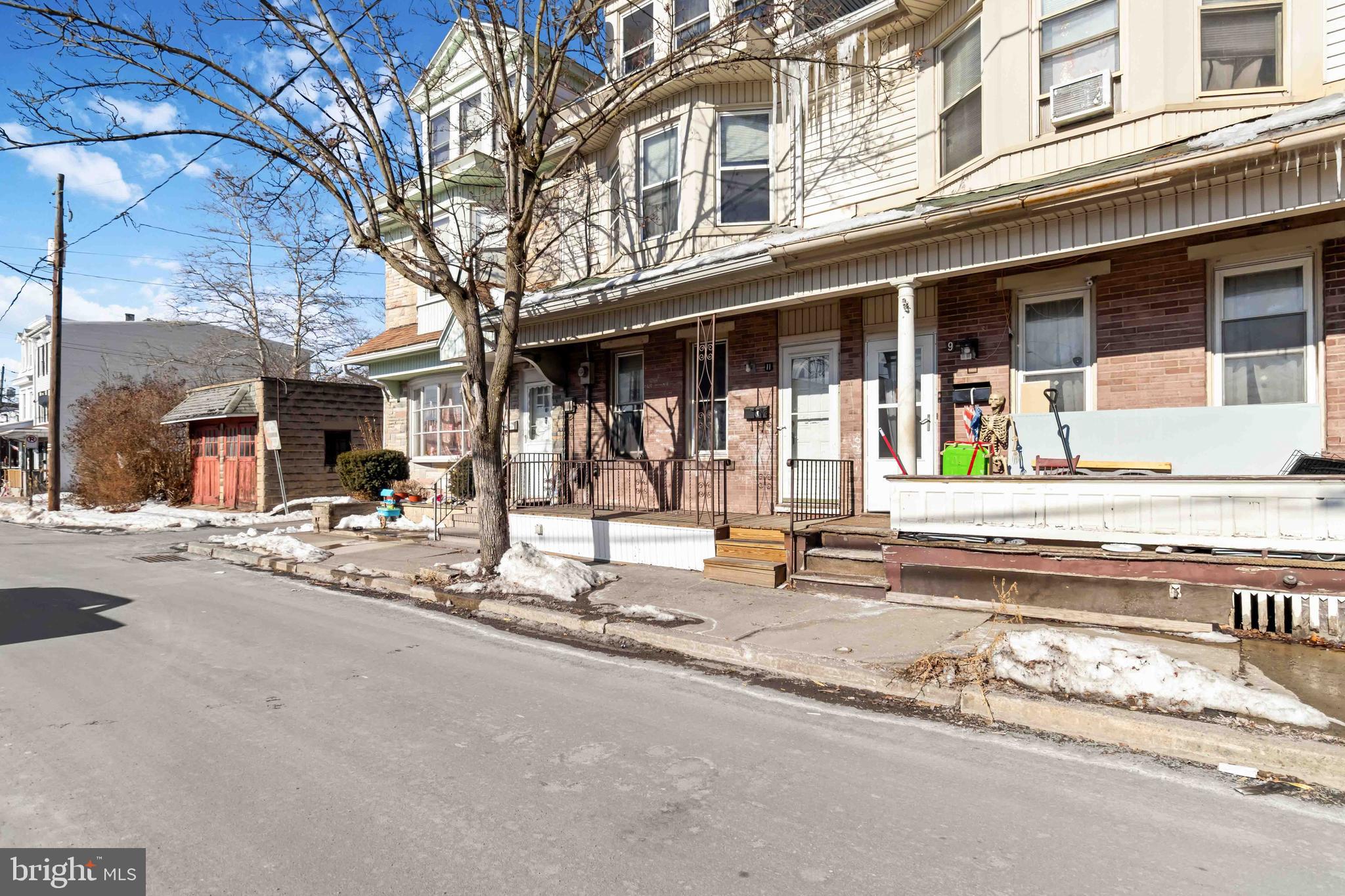 11 West Commerce Street Shamokin, PA 17872 - Photo 2 of 24 front view of a building with a small yard