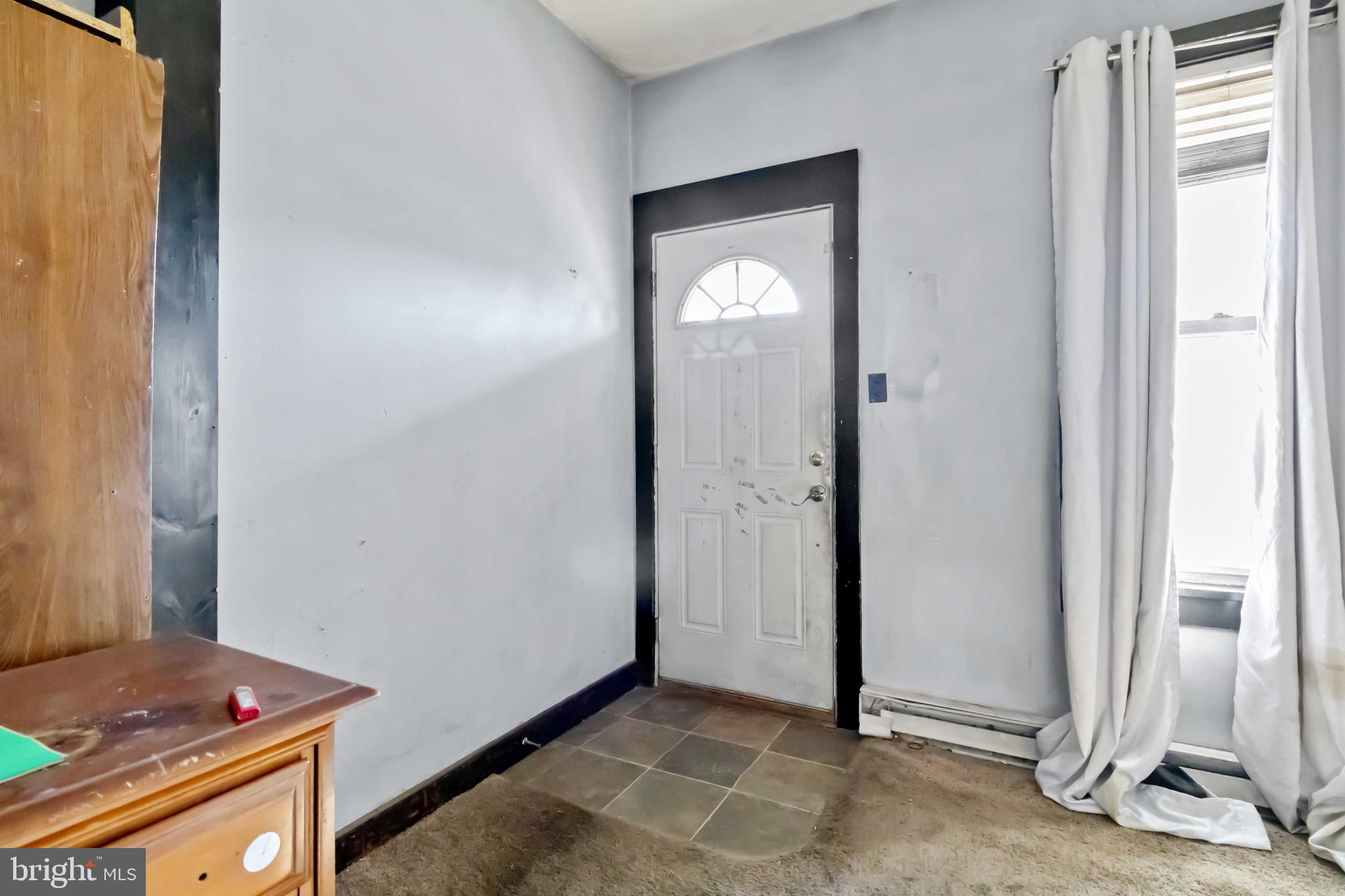 11 West Commerce Street Shamokin, PA 17872 - Photo 5 of 24 a view of empty room with front door