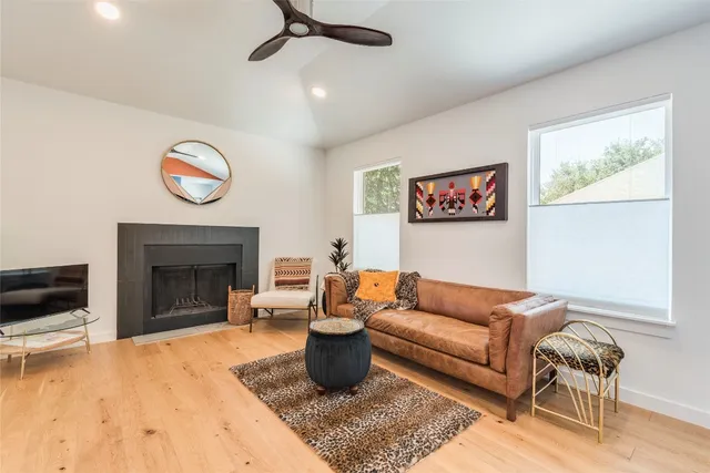 a living room with furniture and a fireplace