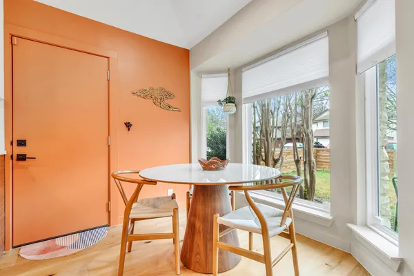 a view of a dining room with furniture window and outside view