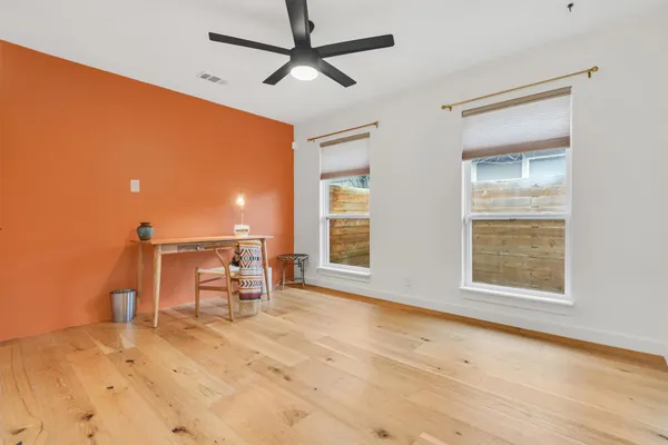 a view of an empty room with a window