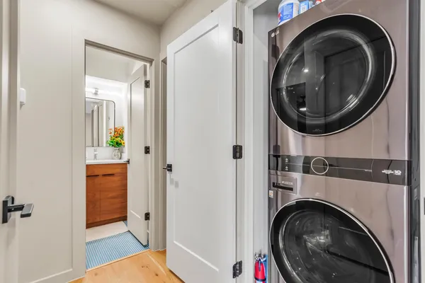 a view of a hallway with washer and dryer
