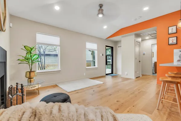 a bedroom with a bed and a potted plant