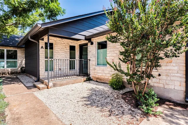 a backyard of a house with seating space