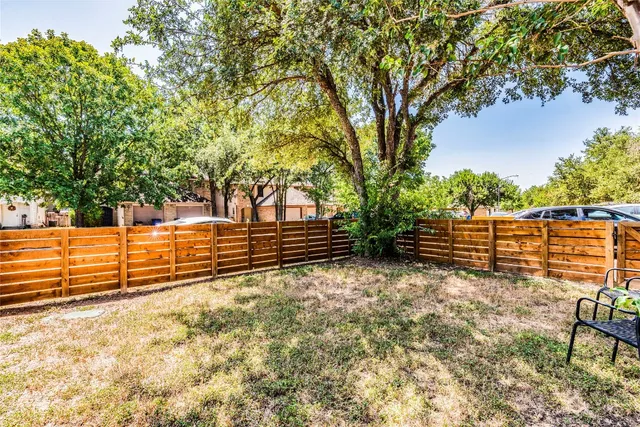 a view of outdoor space with wooden fence