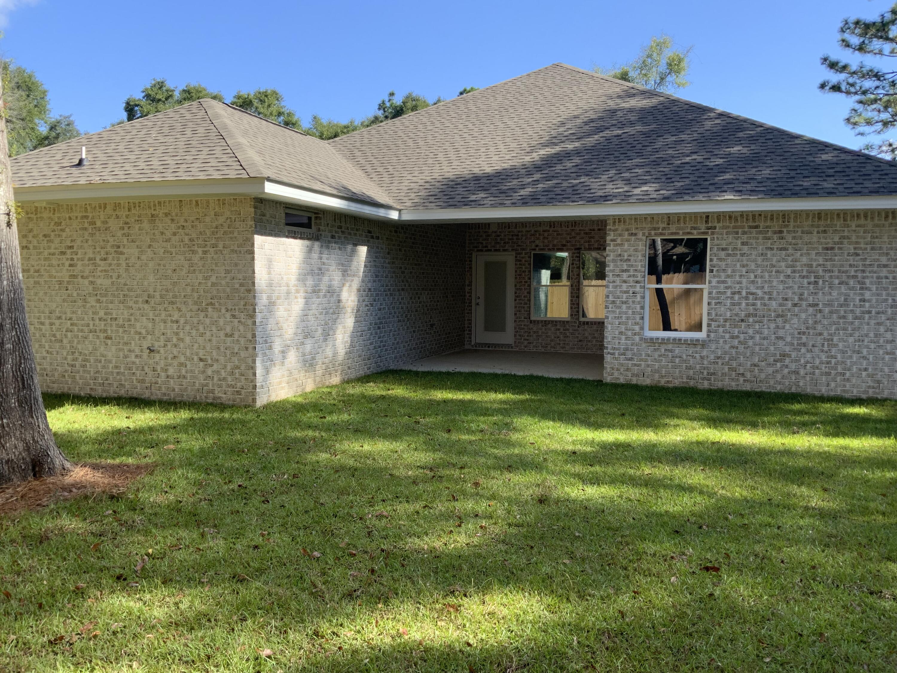 2800 Ram Lane Crestview, FL 32539 - Photo 17 of 20 a view of a house with a backyard