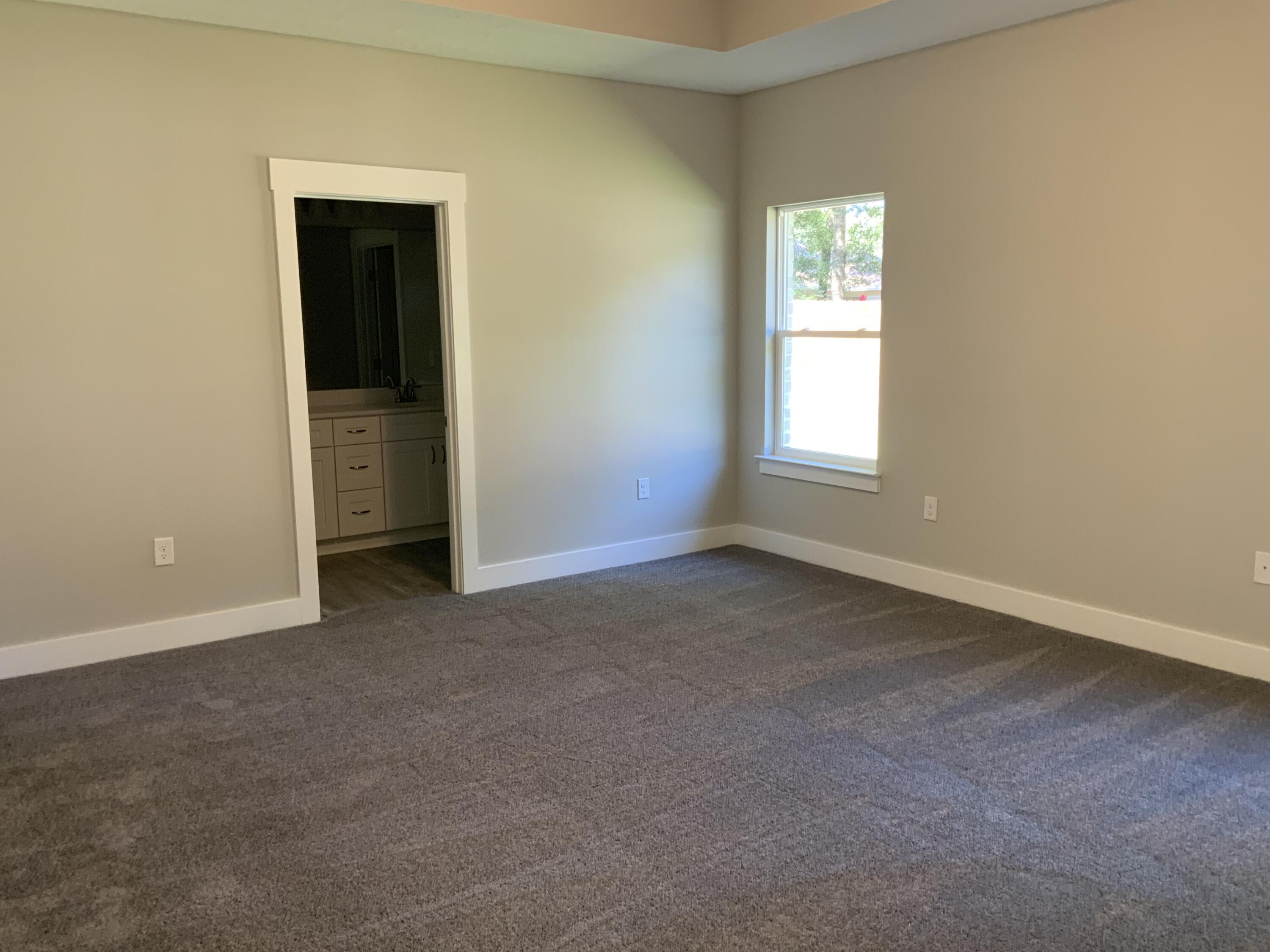 2800 Ram Lane Crestview, FL 32539 - Photo 5 of 20 an empty room with windows and closet