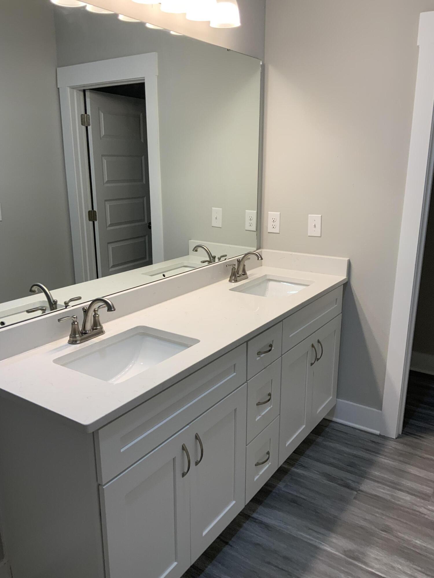2800 Ram Lane Crestview, FL 32539 - Photo 6 of 20 a bathroom with a double vanity sink and mirror
