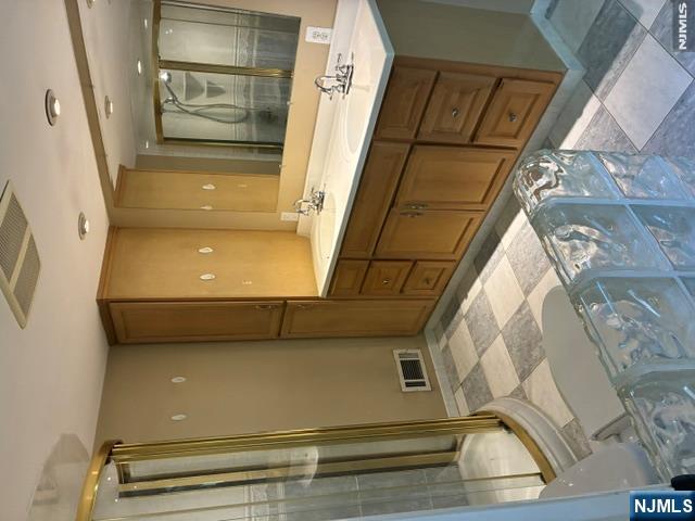 19 Crescent Road Wayne, NJ 07470 - Photo 14 of 26 a bathroom with a sink and a mirror