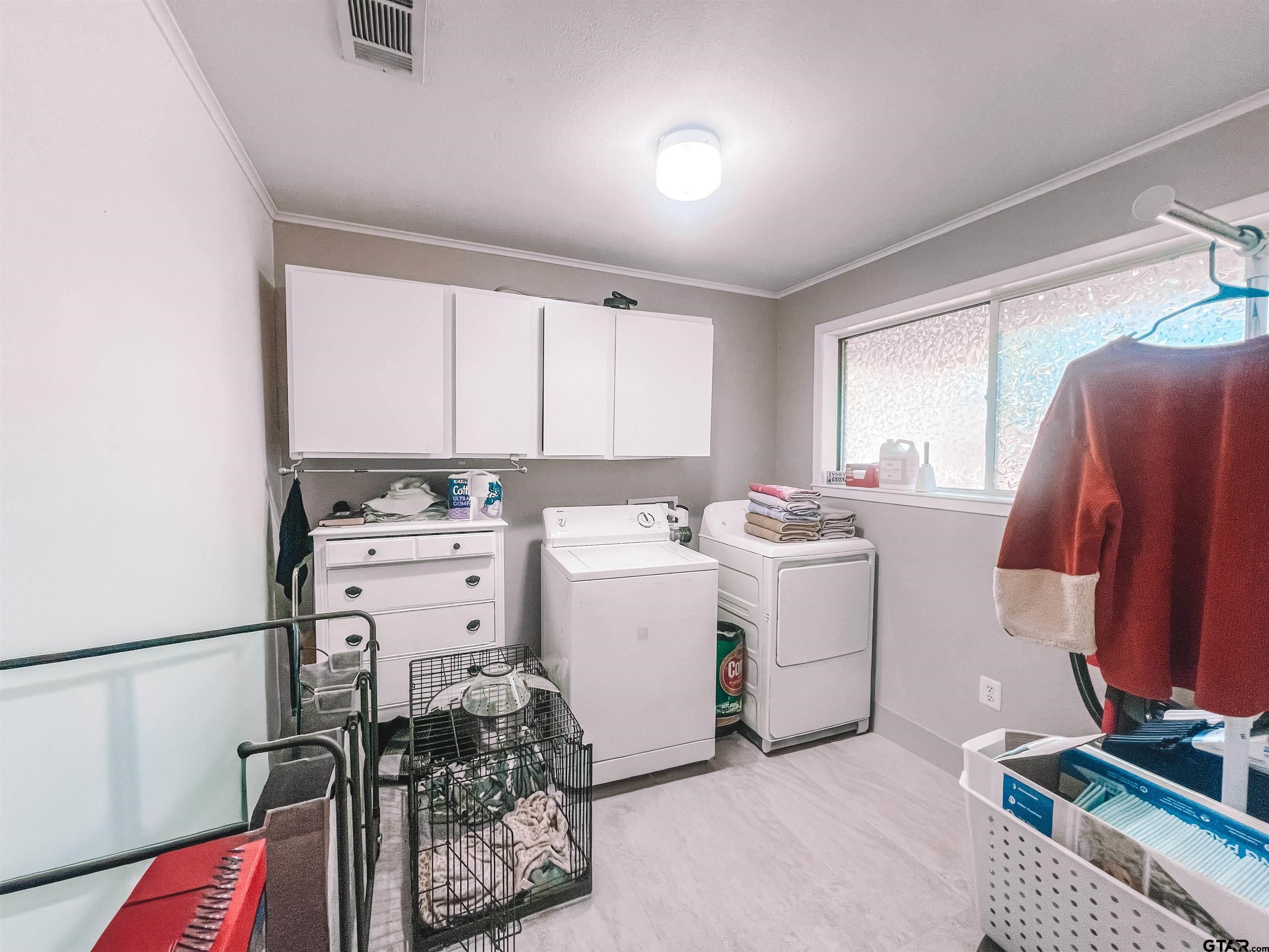 648 Daingerfield Street Pittsburg, TX 75686 - Photo 22 of 27 a view of kitchen with refrigerator and window