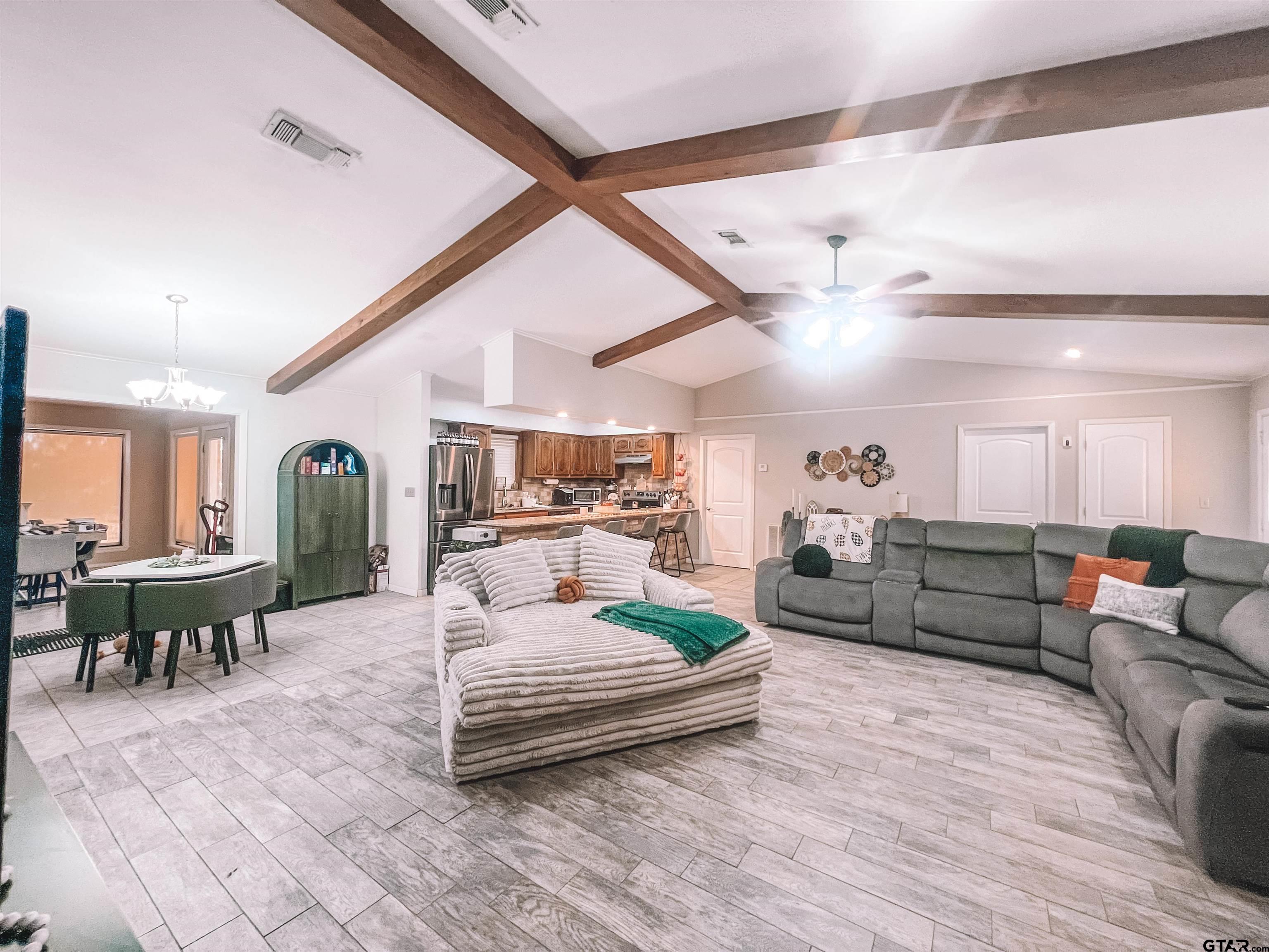 648 Daingerfield Street Pittsburg, TX 75686 - Photo 5 of 27 a living room with furniture and wooden floor