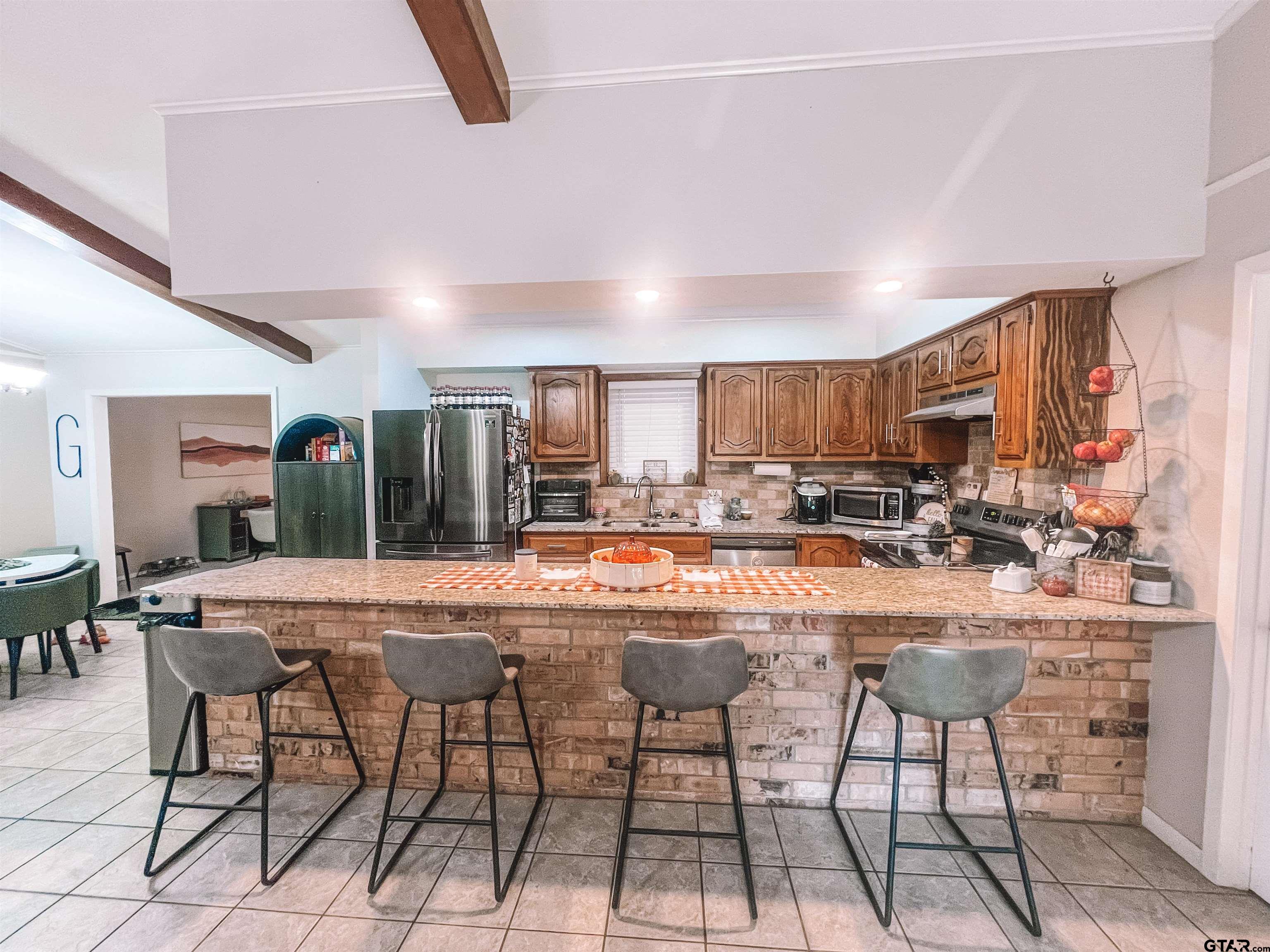 648 Daingerfield Street Pittsburg, TX 75686 - Photo 8 of 27 a view of a dining room with furniture