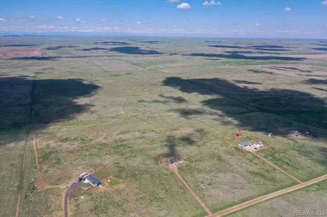 a view of beach and a yard
