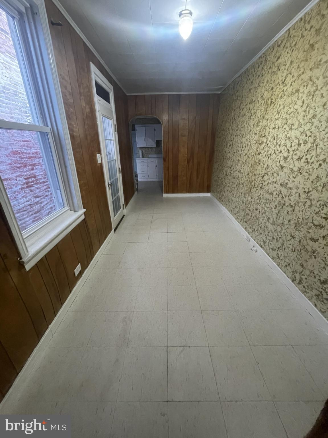 932 Walnut Street Reading, PA 19601 - Photo 3 of 13 a view of an empty room and a bathroom