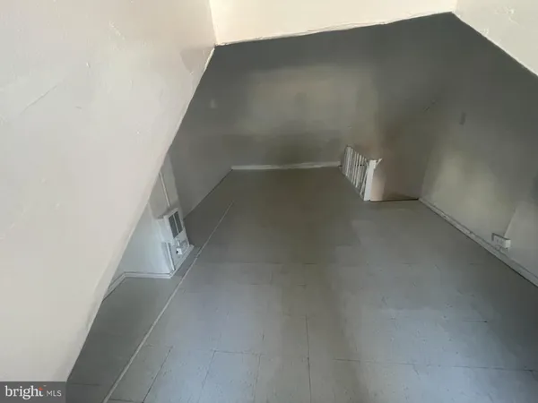 a view of a big room with staircase