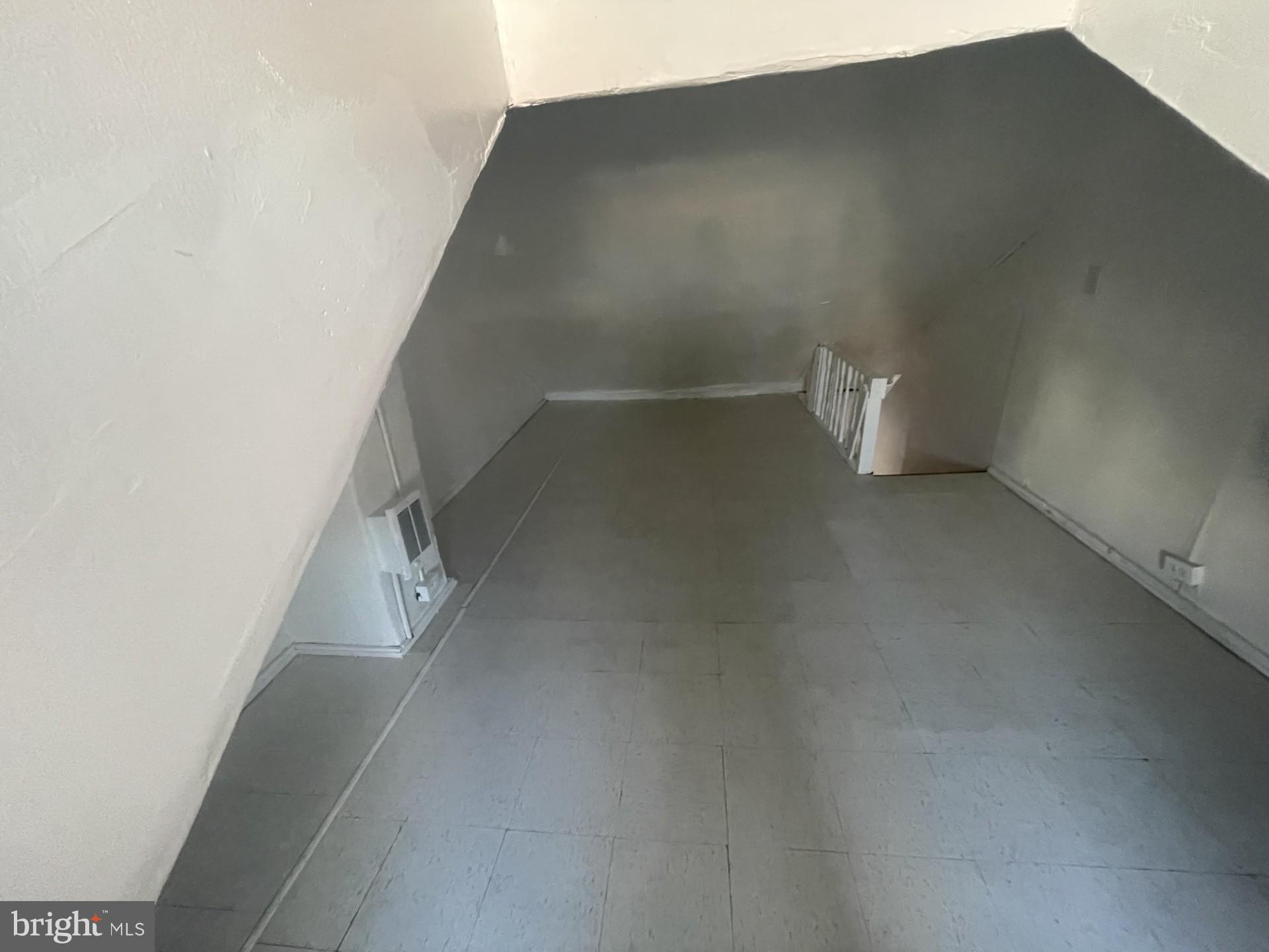 932 Walnut Street Reading, PA 19601 - Photo 7 of 13 a view of a big room with staircase