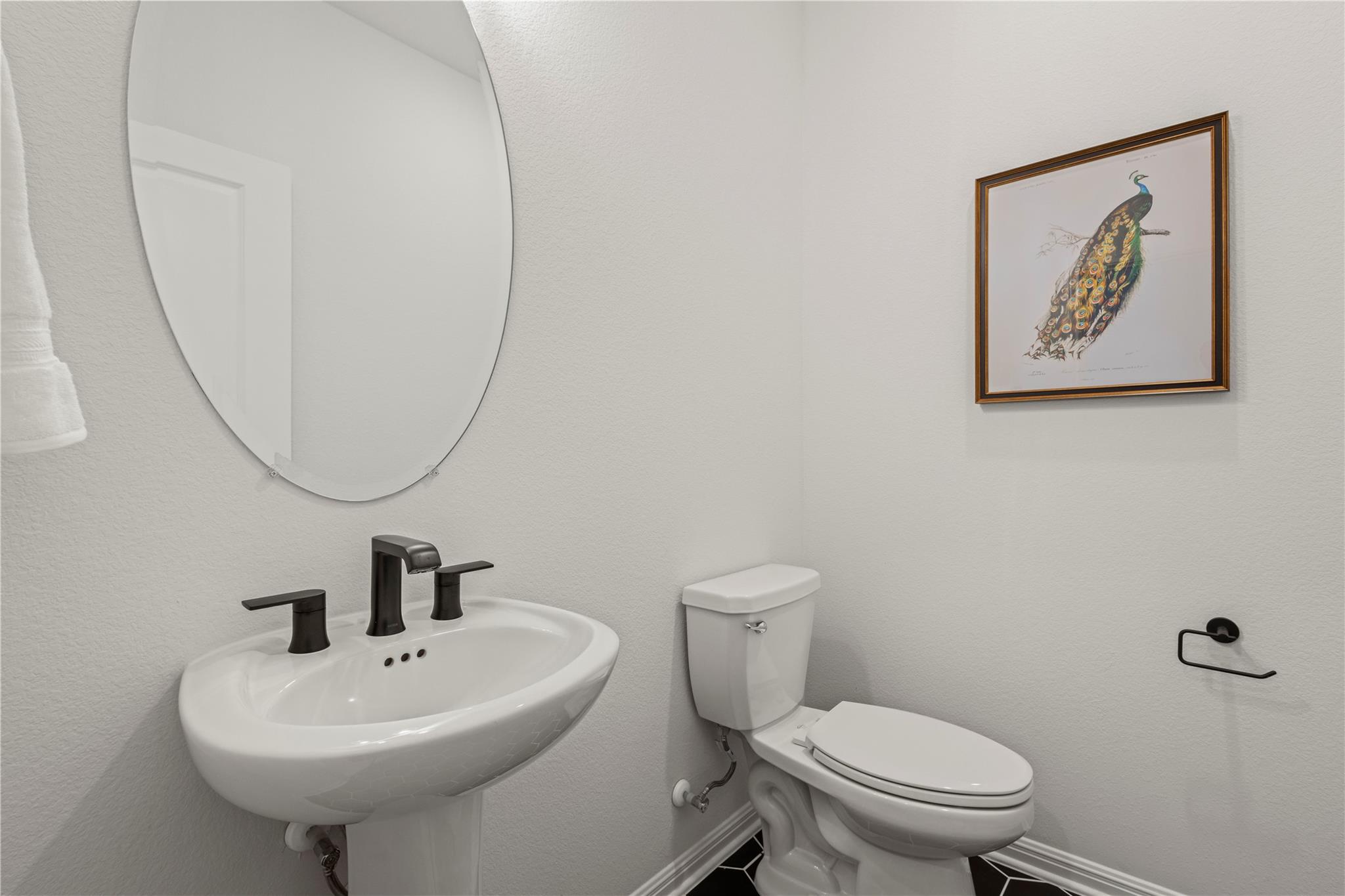 1128 Villa Rialto View Leander, TX 78641 - Photo 11 of 40 Half bathroom with toilet and baseboards