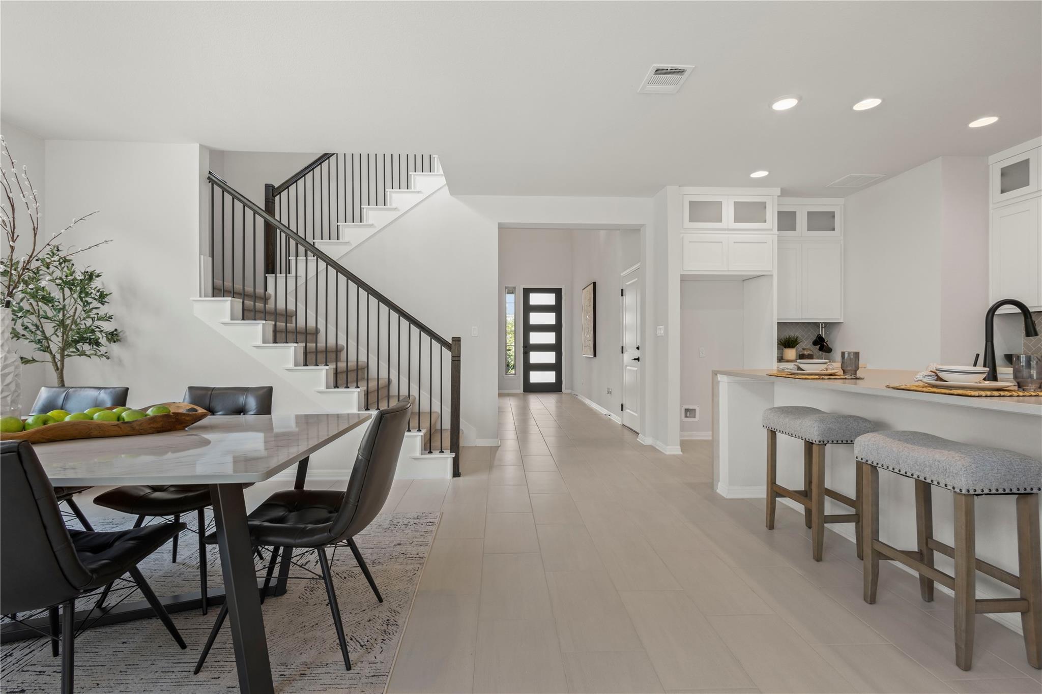 1128 Villa Rialto View Leander, TX 78641 - Photo 19 of 40 Dining room featuring stairway and recessed lighting