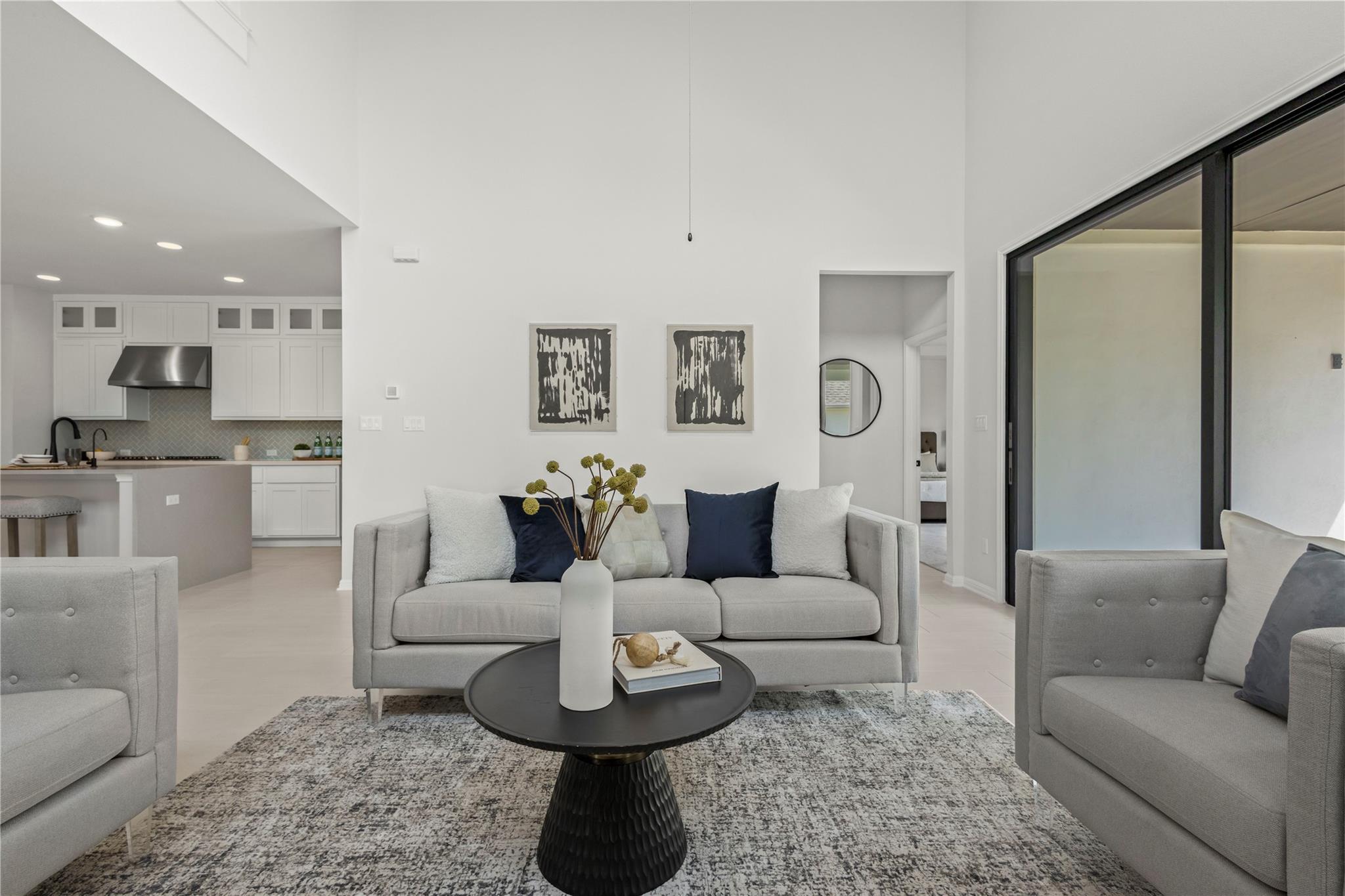 1128 Villa Rialto View Leander, TX 78641 - Photo 21 of 40 Living room with recessed lighting and a high ceiling