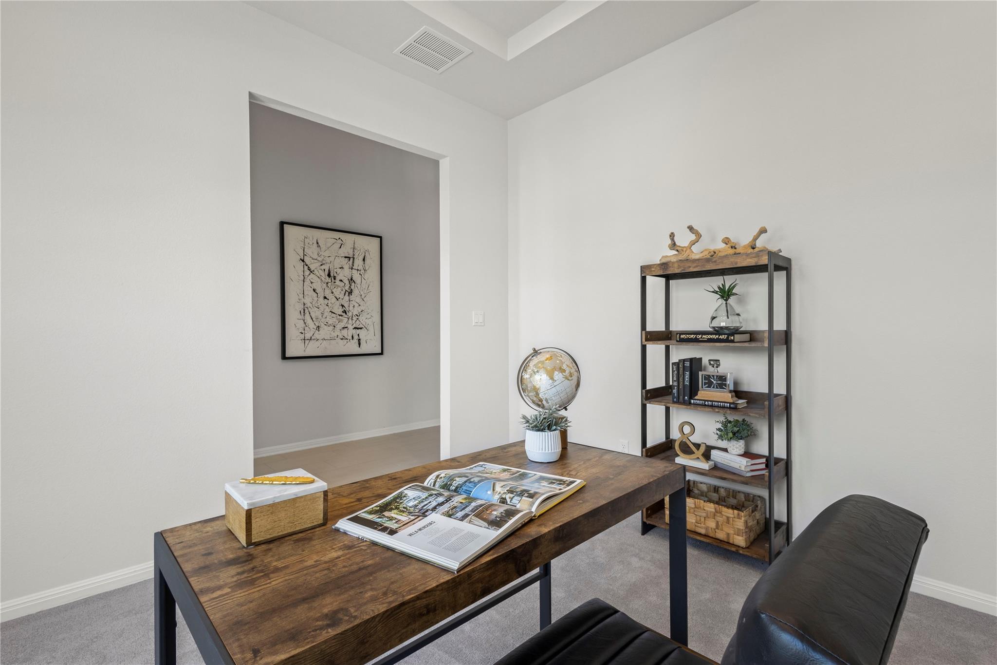 1128 Villa Rialto View Leander, TX 78641 - Photo 9 of 40 Home office with dark colored carpet and baseboards